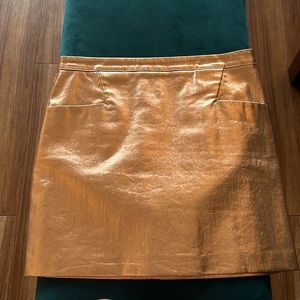 Club Monaco rose gold lamé skirt size 8. Slight stretch.